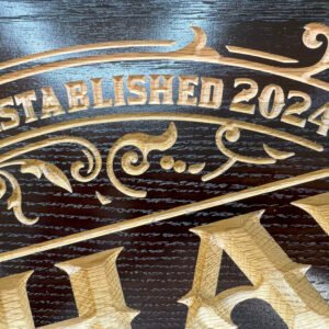 Stained and engraved walnut sigh